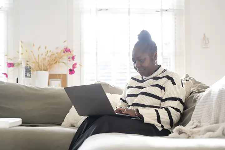 Woman working at home on a computer